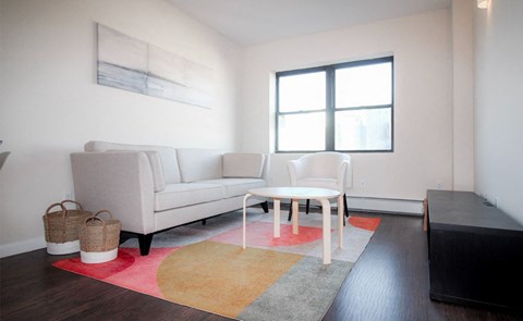a living room with a couch and a table