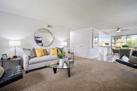 a living room with a couch and a table